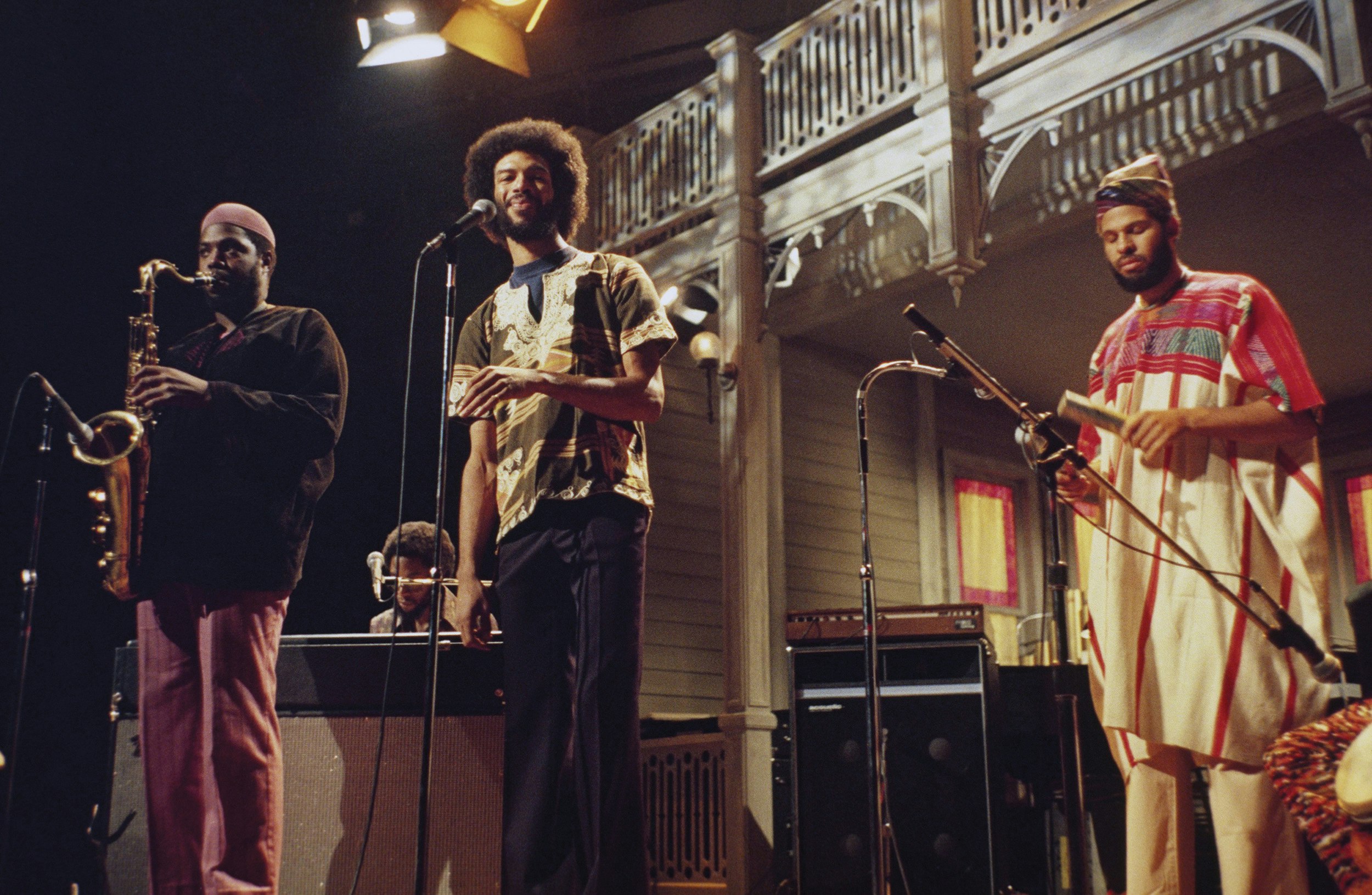 Brian Jackson (at Rhodes electric piano) and Gil Scott-Heron (center), with band, on <i>Saturday Night Live</i>, 1975. Photo via NBCU Photo Bank.